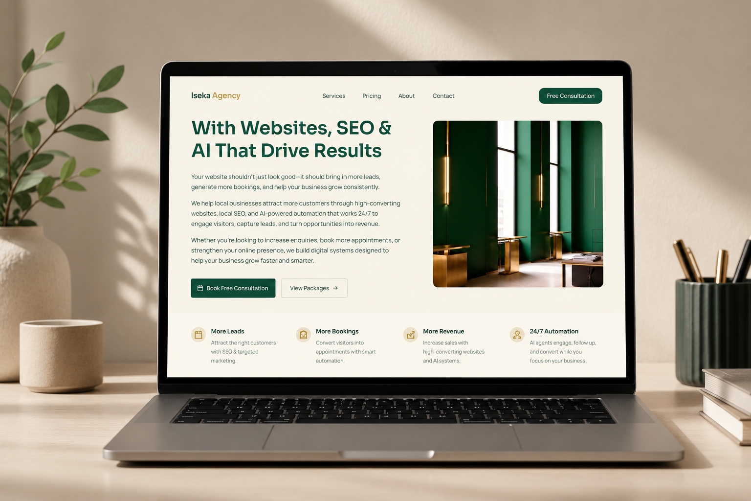 Iseka Agency website shown on a laptop mockup in a premium workspace